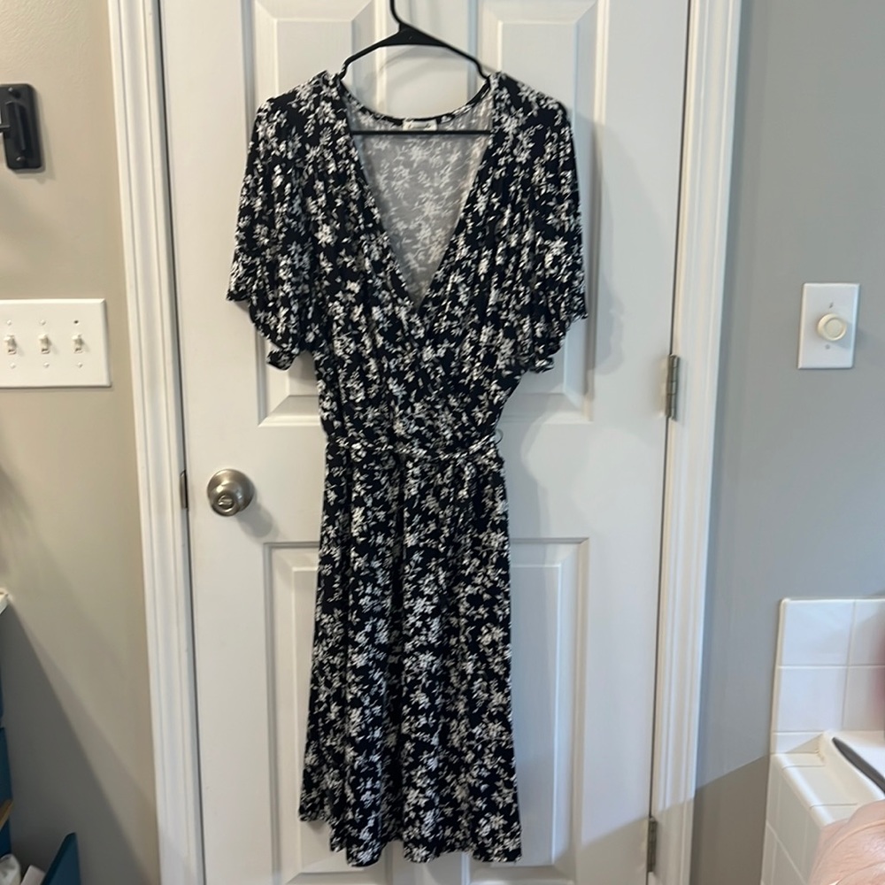 NWOT lovapella faux wrap dress in black and white floral pattern